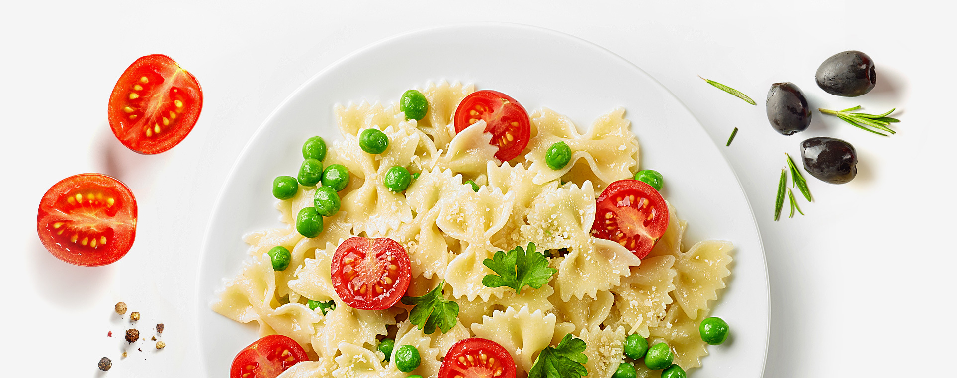 Plate - pasta with tomatoes and peas.