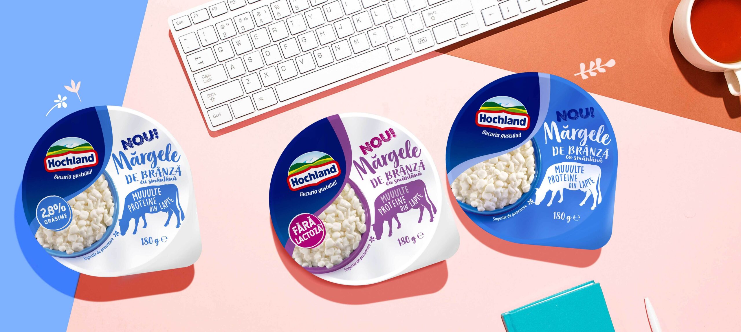 Cottage cheese packaging design for Hochland Margele de Branza line in an office surrounding. - desk, cup of tea and keyboard.