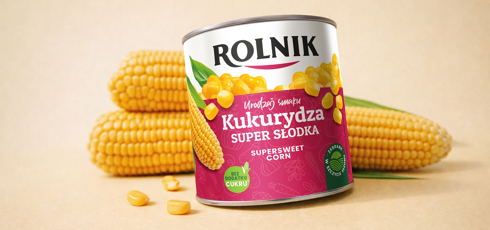rebranding_marki_Rolnik - wizualizacja nowego opakowania kukurydzy w puszce otoczona kolbami kukurydzy